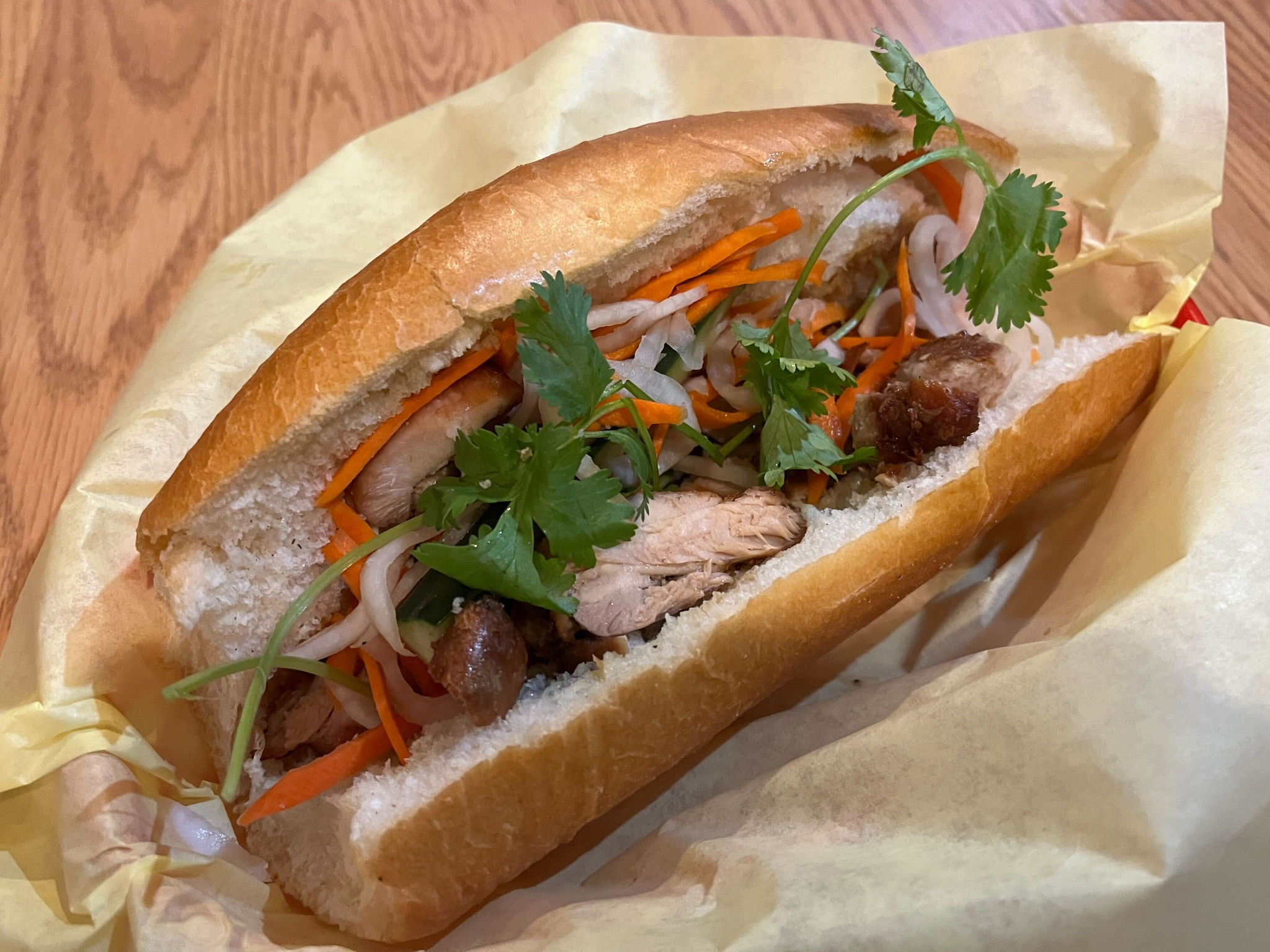 Vietnamese chicken banh mi with cilantro and pickled vegetables