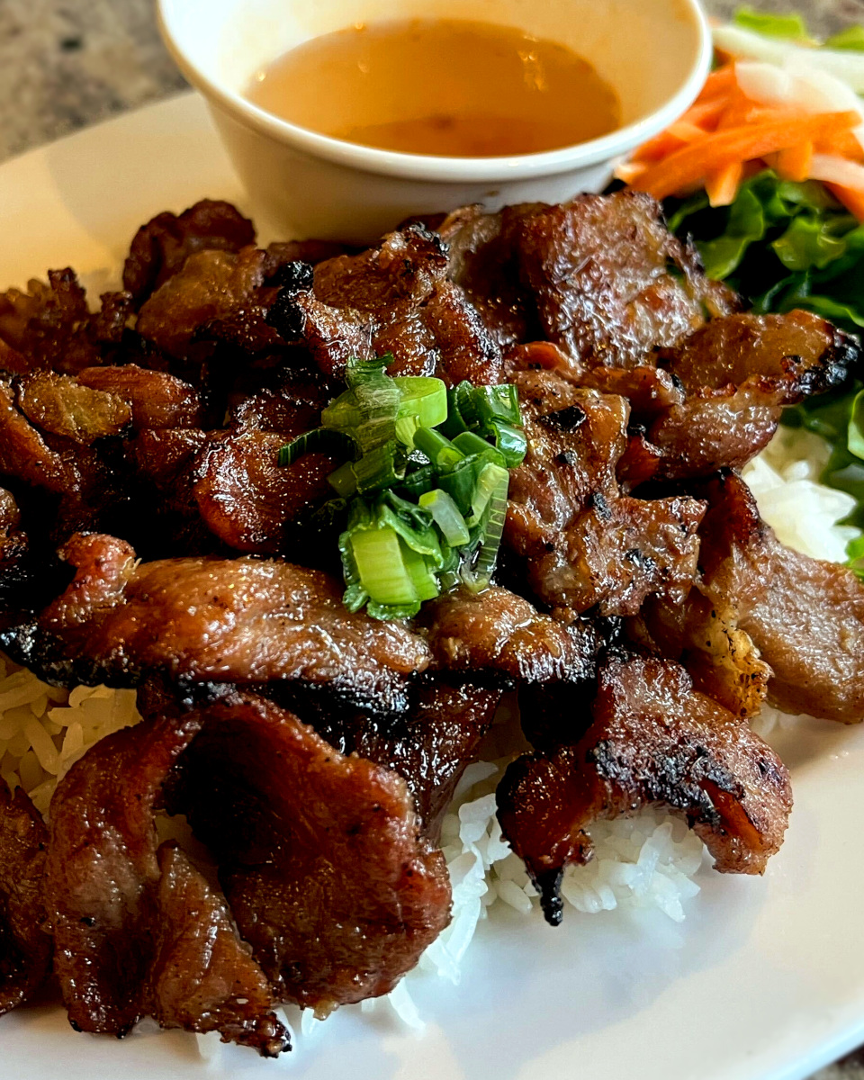 grilled pork rice plate with vegetables